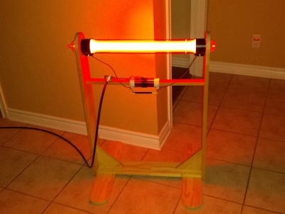 A wooden stand for a Bill Cheb SSQ-BAT Plasma Tube.